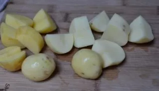 Cut the potatoes into small equal proportions and cook in salted water until tender.