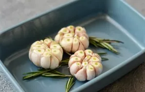 Transfer to a baking dish. Sprinkle with olive oil. Put a sprig of rosemary in it. Cover with foil and bake in a preheated oven at 150 de...