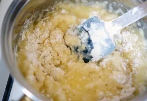 Add 2 tablespoons of sugar and add flour. Knead the dough quickly.