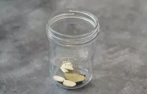 Add all the spices to the bottom of the jar.