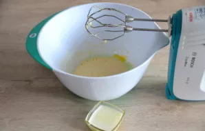 Pour the melted butter into the mixture.