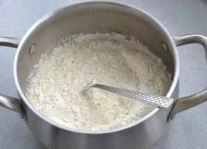 Add half the flour, stir and let the dough stand for 40-45 minutes