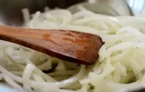 Over medium heat, fry the onion until tender.