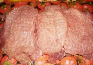 Beat the meat on both sides with a kitchen hammer. I usually get about 12 steaks from a kilogram of tenderloin.