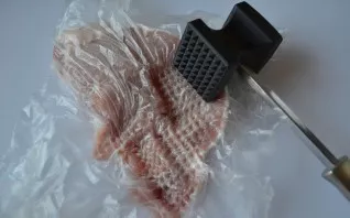 Wrap it in cling film and beat well.