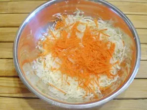 Add finely chopped carrots to it.