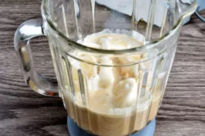 Put ice cream in a blender, pour cold coffee and chilled milk. Add rosehip syrup or any other to taste.