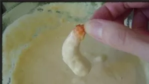 Prepare the dough in advance for baking shrimp. Pour beer or mineral water into the flour and beat the egg. The dough should look like pa...