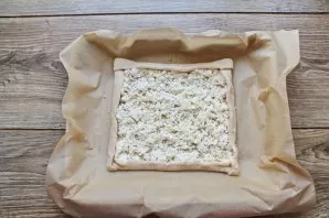 Spread cottage cheese on top of the dough.
