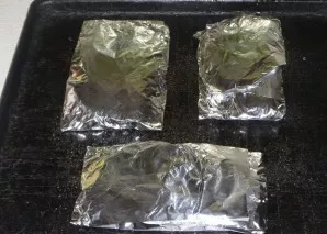 Wrap each piece in foil. Bake the fish in an oven at 180 degrees for 30 minutes.