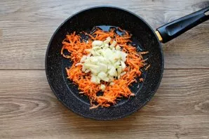 Peel the onion and chop it finely, grate the carrots on a coarse grater. Pour vegetable oil into the pan and heat over medium heat, add v...