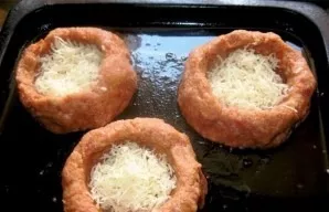 We make a hollow in the center of each ball, we should get a kind of baskets, nests. Grate the cheese and put it in these grooves. Add a ...