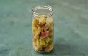 Put the crushed rhubarb in a jar.