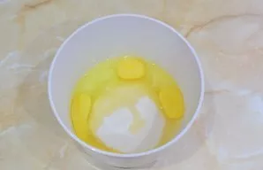 Separately, mix eggs with sugar.