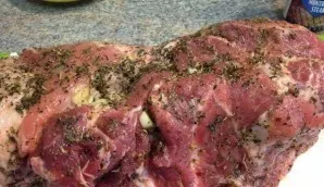 In a separate bowl, mix tarragon, rosemary and ground pepper. Then add four tablespoons of whiskey to them and mix well. Rub the meat wit...