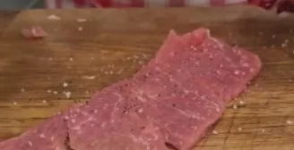 Knock out each square of meat on both sides, salt with coarse salt and pepper. Leave in a bowl covered with cling film, let it marinate a...