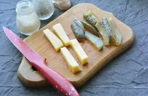 Cut the cheese and pickles into strips.