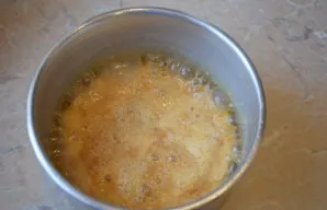 When the sugar dissolves, gradually pour in the hot cream. Sugar will become solid. Thats the way its supposed to be.