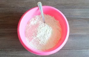 After the time has passed, add 2/3 of the specified amount of flour.