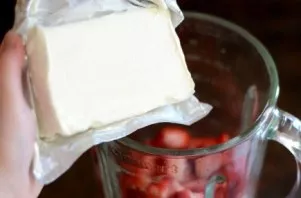 Put the cream cheese in a blender.