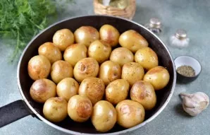 After the specified time, remove the pan from the oven, each potato must be turned over, as it will brown on the bottom. Place the potato...