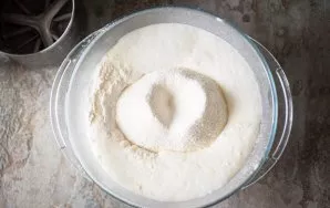 Sift flour into the kefir mixture.