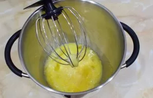 Separately, beat eggs with sugar into a fluffy, thick mass.