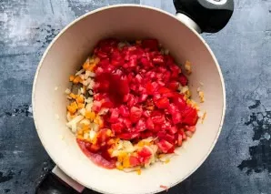 Rinse the tomatoes under running water, dry with paper towels, chop finely and add to vegetables. Pour in the tomato paste, mix everythin...