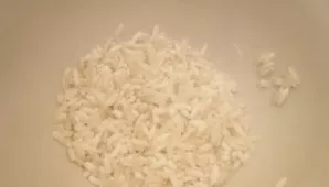 Rinse the rice under hot water.