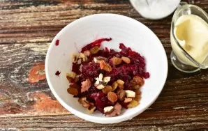 Add raisins and walnuts.