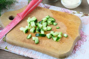For cucumbers, cut off the stems. Cut them also into medium cubes.