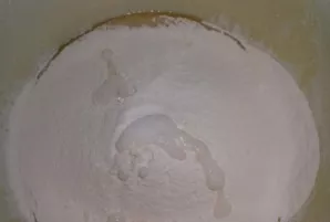 Mix eggs with melted butter, add a little flour, salt and soda, scalded with vinegar.