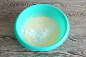 Add sifted flour, vanilla sugar, baking powder. Mix with a mixer at low speed.