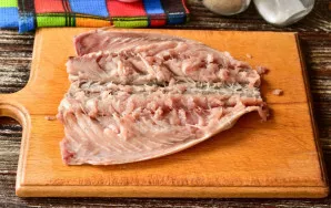 Clean the fish, cut lengthwise, but not completely, remove the ridge, head and tail.