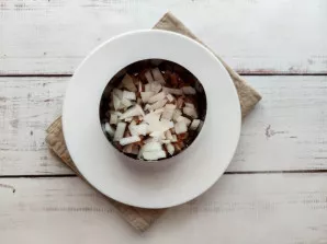 Put finely chopped onion on top of the fish.