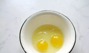 In a separate bowl, beat the eggs.