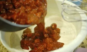 Pour the hot mixture into the flour mixture, beat with a mixer.