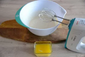 Add melted butter to the beaten eggs and beat.