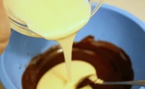 Crush the yolks with half the sugar. In a water bath, melt the chocolate. First, pour chocolate into the butter, then the yolks, mix ever...