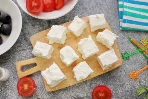 Cut the feta into cubes the size of cherry tomatoes.