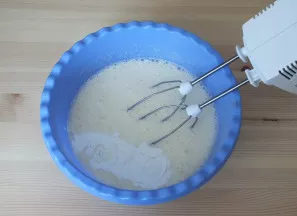 Add warm kefir, baking powder. Keep whisking.