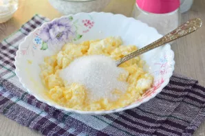 Add sugar, baking powder and mix.