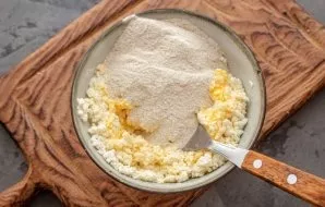 Add gluten-free flour. Flour can be more or less, it all depends on the humidity of the cottage cheese, so choose cottage cheese as dry a...