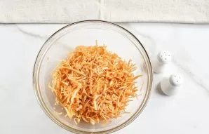 While the chicken is marinating, finely chop the cabbage, add salt to taste, add paprika and mix well until the cabbage softens and turns...