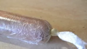 Carefully wrap the roll in cling film.