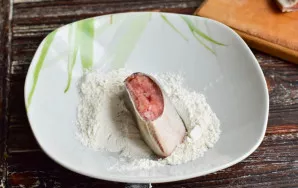 Dip each piece in flour.