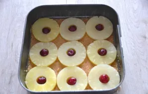 Put pineapple flowers on top of the sugar layer, put cherries inside the flower.