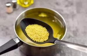 Then add millet to the broth. Boil potatoes and millet for 20 minutes over medium heat.