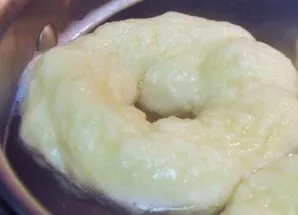 In a large saucepan, bring the water to a boil and add soda. Put the resulting dough circles in boiling water and cook on both sides for ...