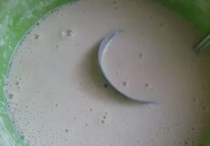 Then add the vegetable oil and mix well again. If the dough is thick, add a little water or milk.